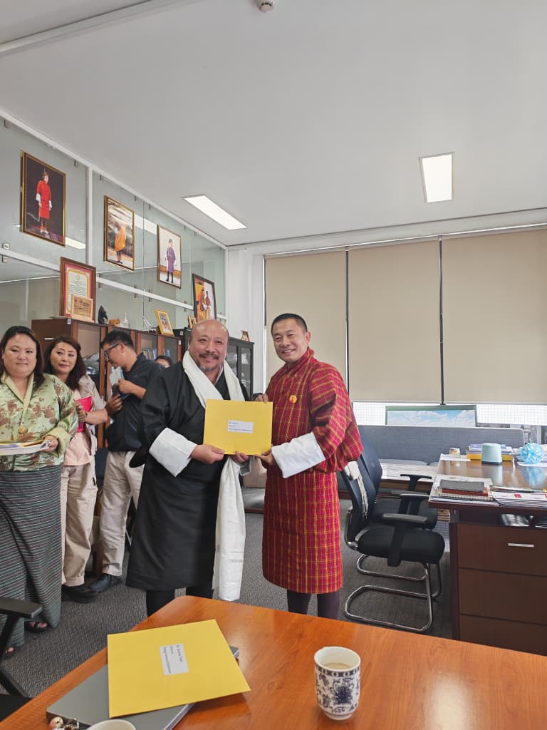 Director receiving Tashi Khadar and appointment letter