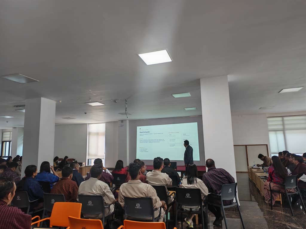 Presenter leading a session in front of the audience during the IPMS training