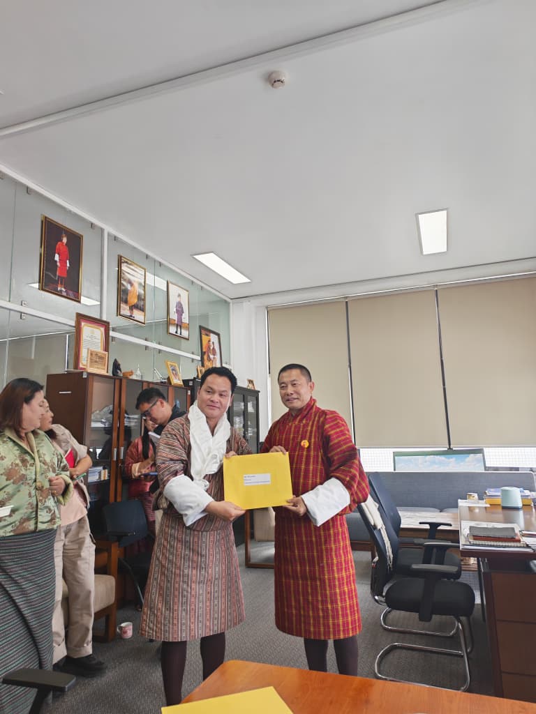 Director receiving appointment letter with Tashi Khadar